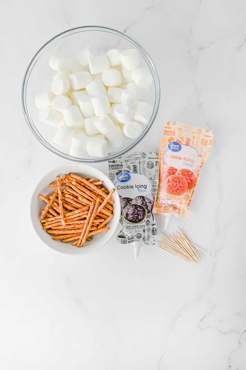 Supplies for snowman toppers laid out on counter ready to assemble.