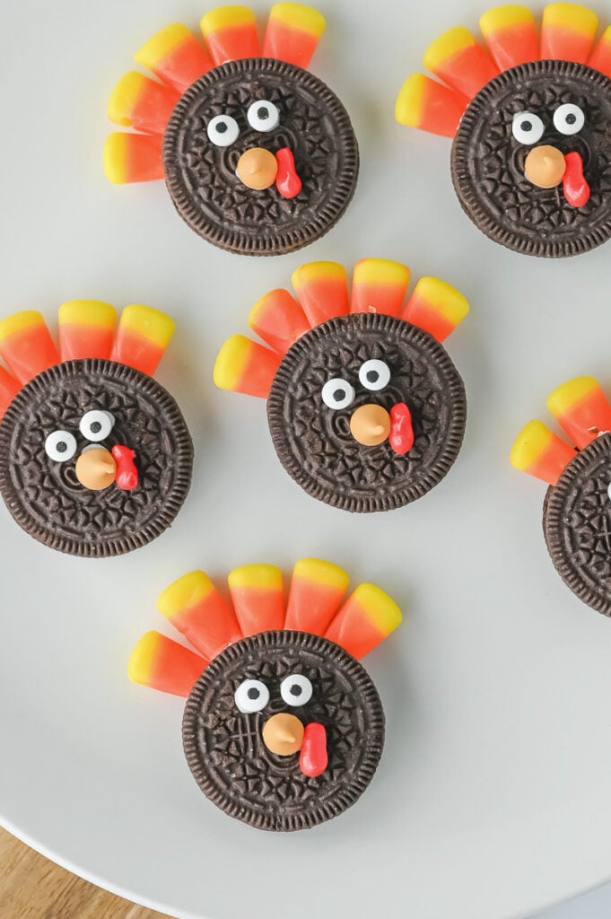 Oreo turkey cookies on a white plate.