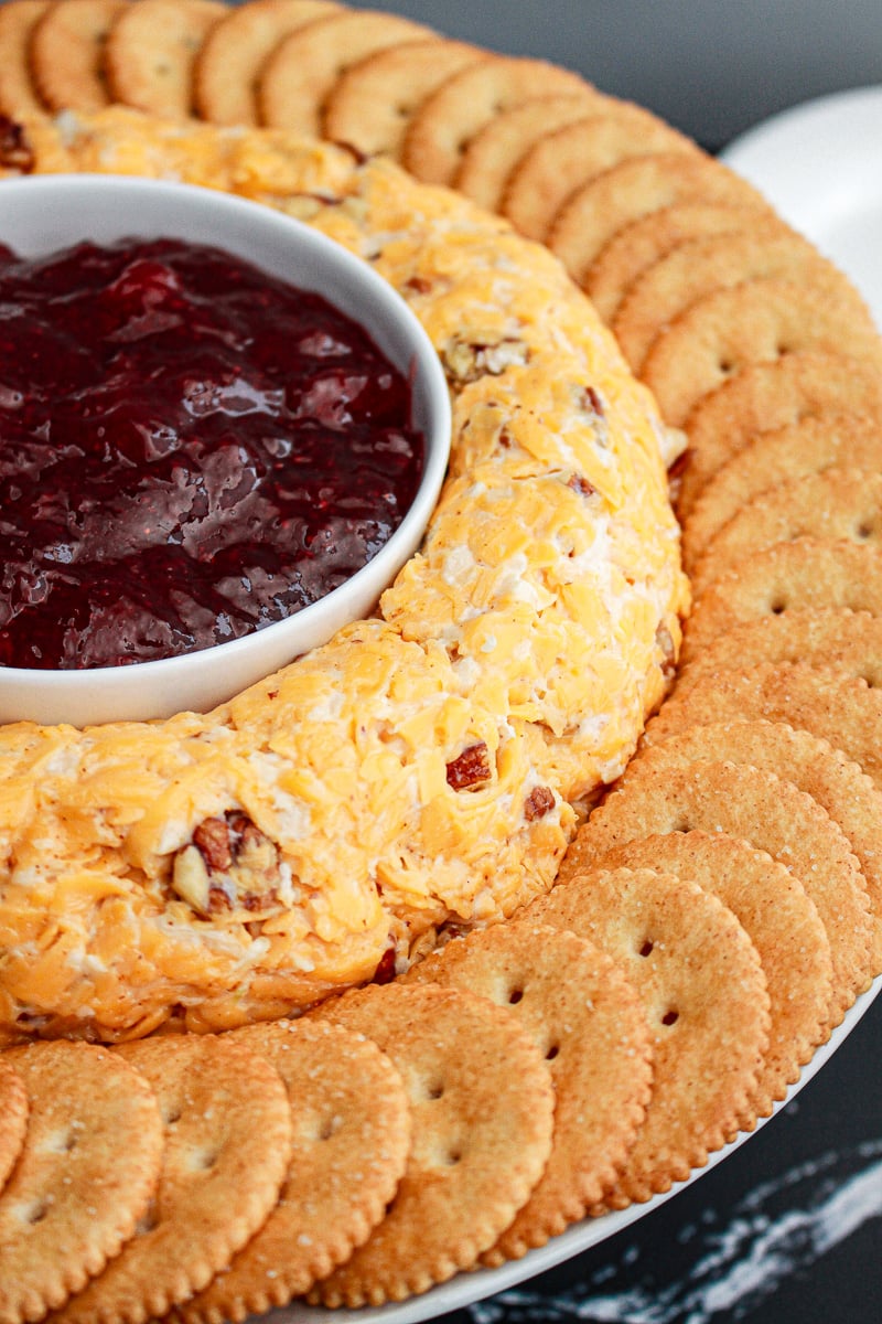 Rosalyn Carter's cheese rings with a bowl of preserved in the middle and crackers placed around the outside.