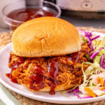 Crockpot bbq chciken served on a bun.