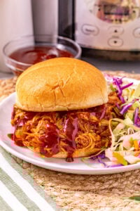 Crockpot bbq chciken served on a bun.