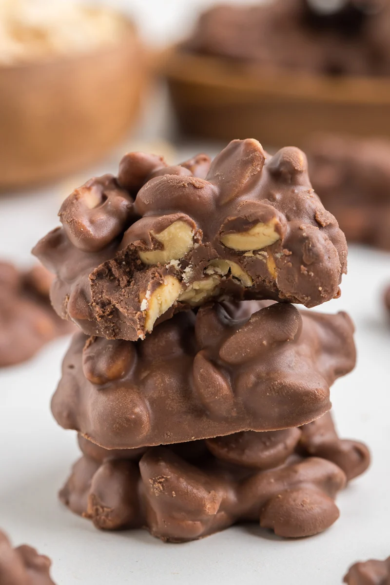 3 ingredient crockpot candy stacked on a plate.