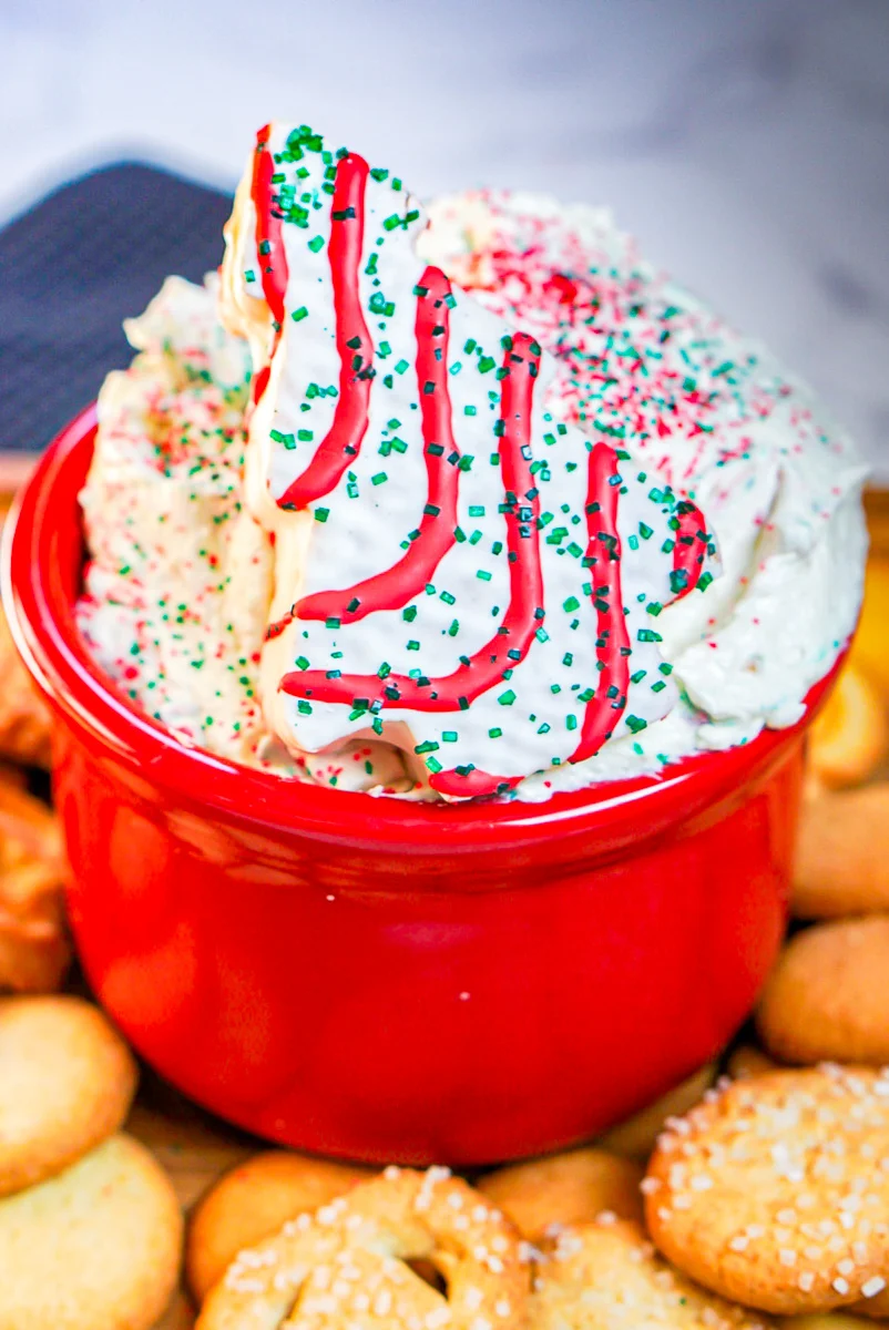 Christmas tree cake dip served in a red bowl.