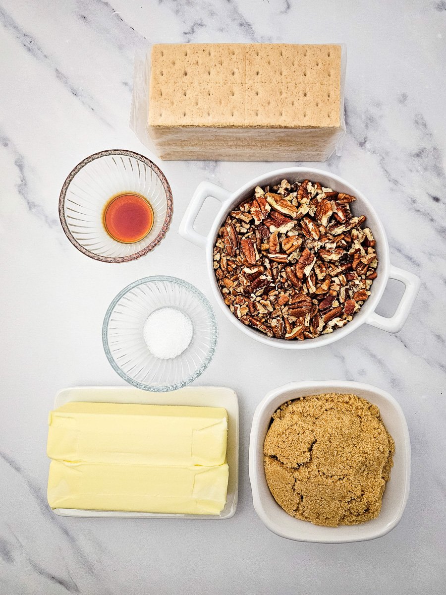 Ingredients for pecan pie bark in small bowls on counter.
