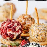 Mini chese ball bites with various topping on a parchment lined sheet ready to serve.