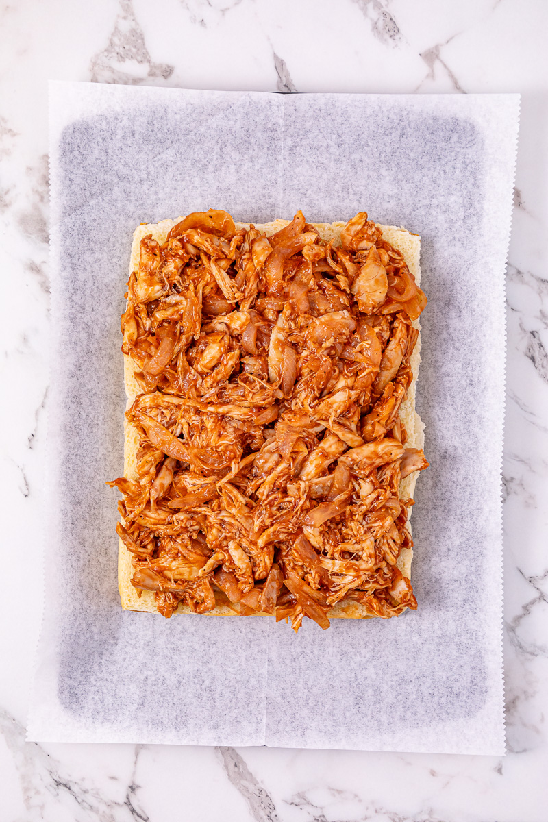 Chicken mixture is spread on top of bottom slider rolls.