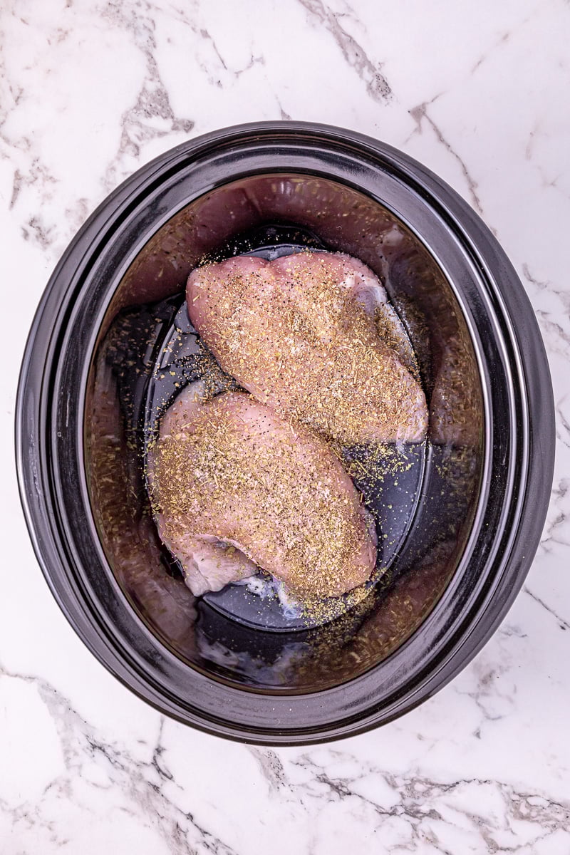 Turkey tenderloins in bottom of crockpot.