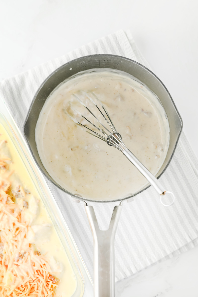 Milk is adde to the saucepan.