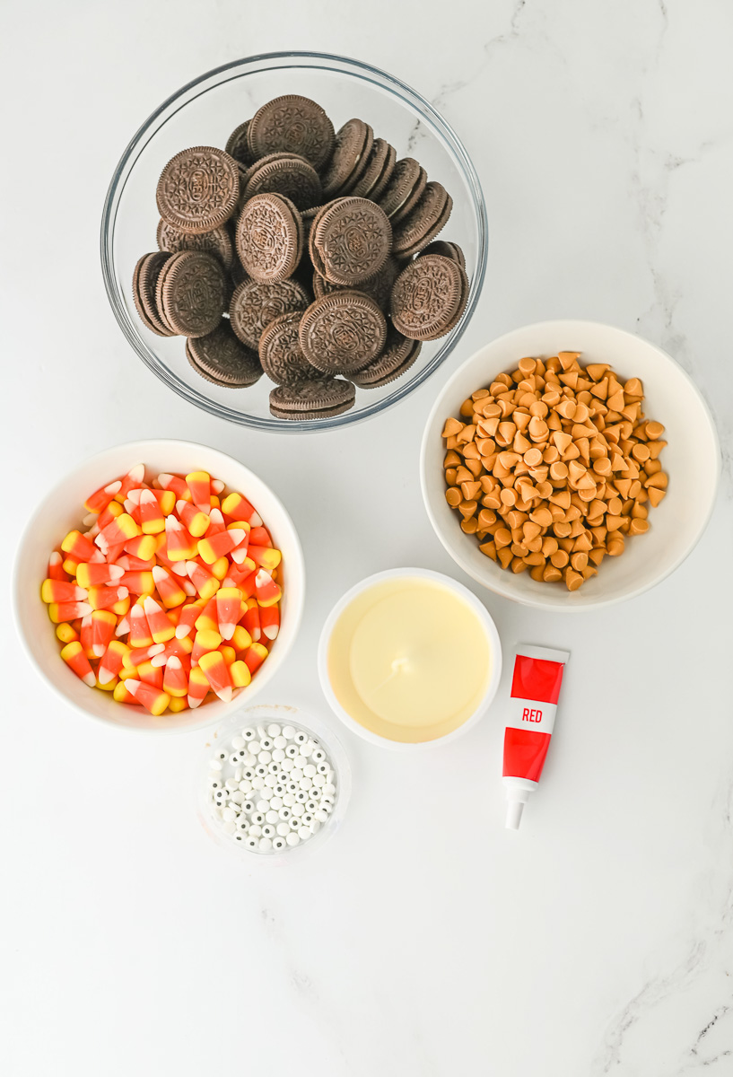 Oreo turkey cookies ingredients in small bowls on counter.
