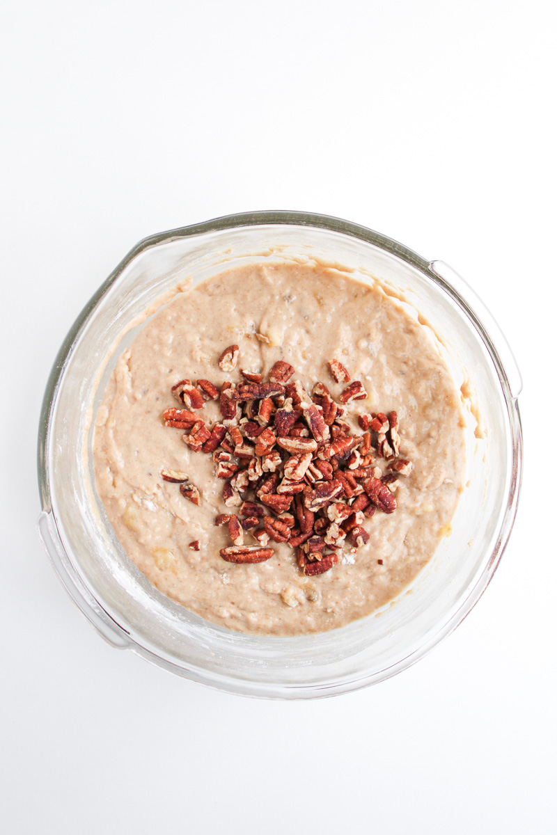 Chopped pecans are stirred into the pancake batter.