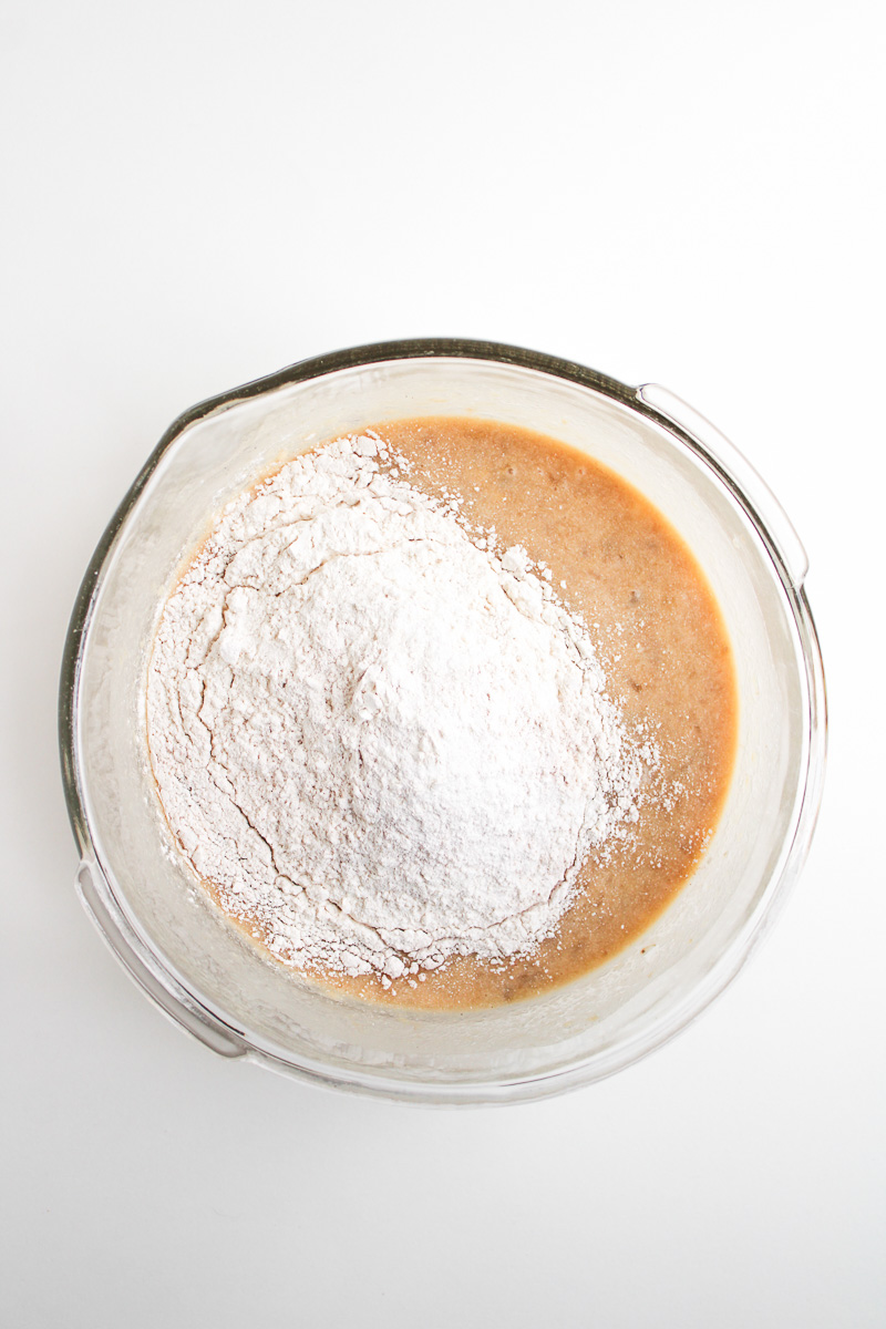 Dry ingredients are added to the wet ingredients.