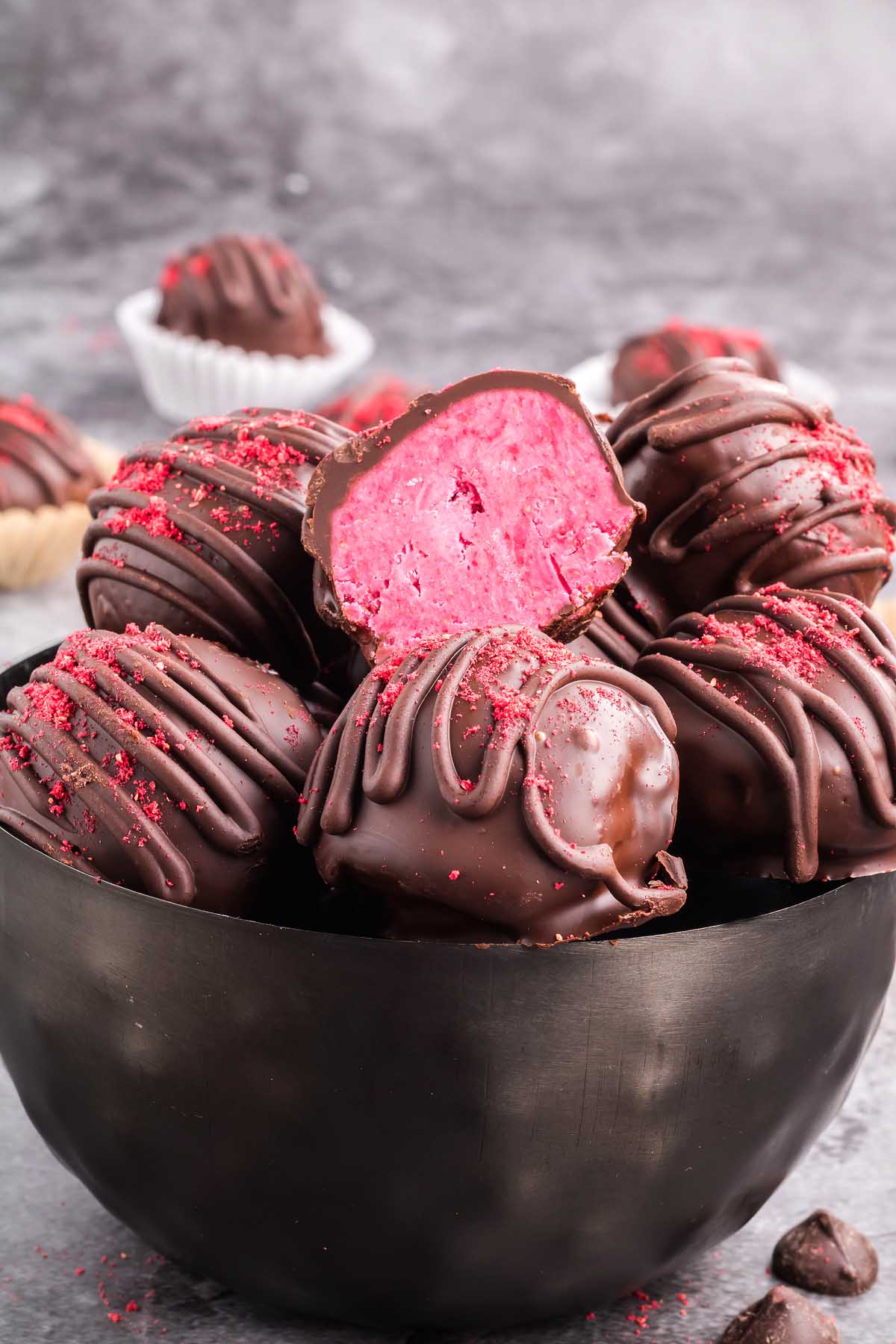 Raspberry truffles in a bowl.
