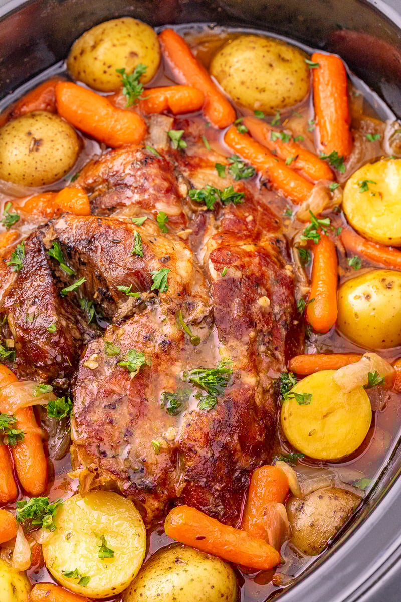 Pork roast in crockpot with veggies.