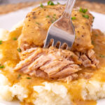 Close up view of fork with ranch pork chops.