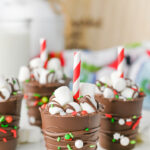 Hot chocolate on a stick on counter.