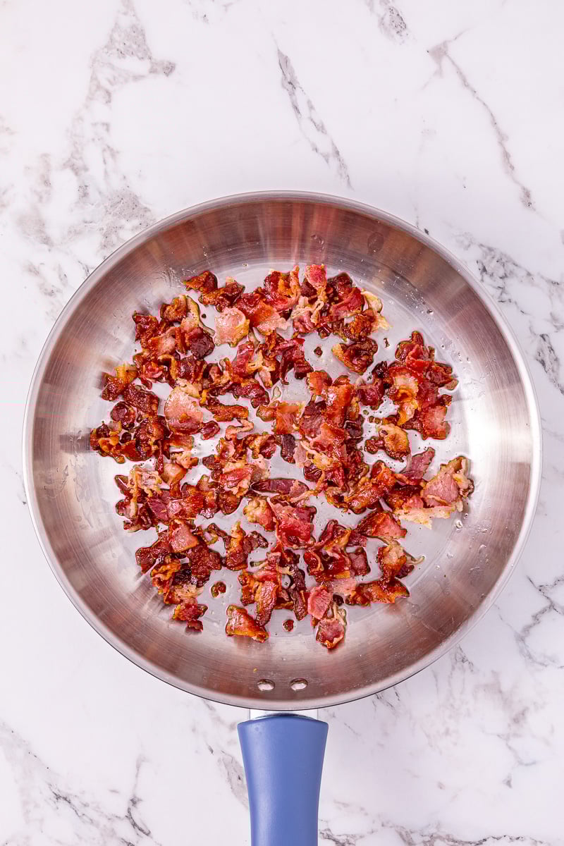 Cooked bacon in skillet.