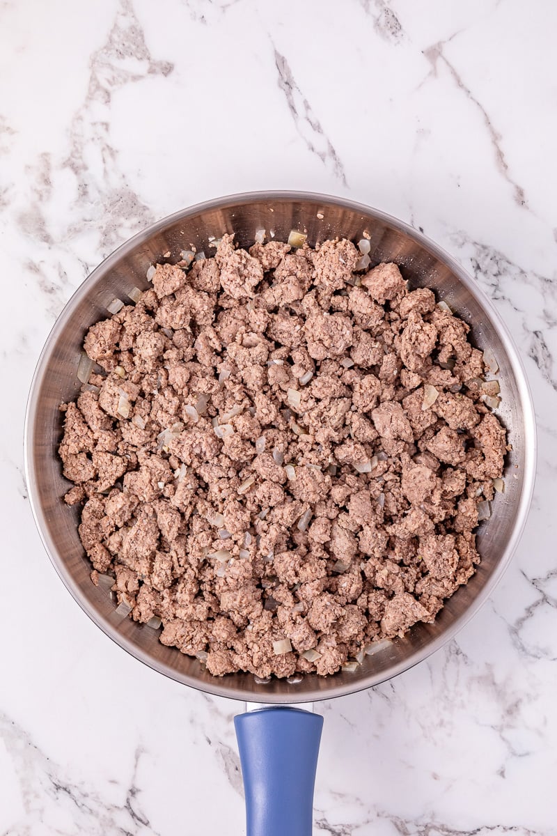 Cooked ground beef in skillet.