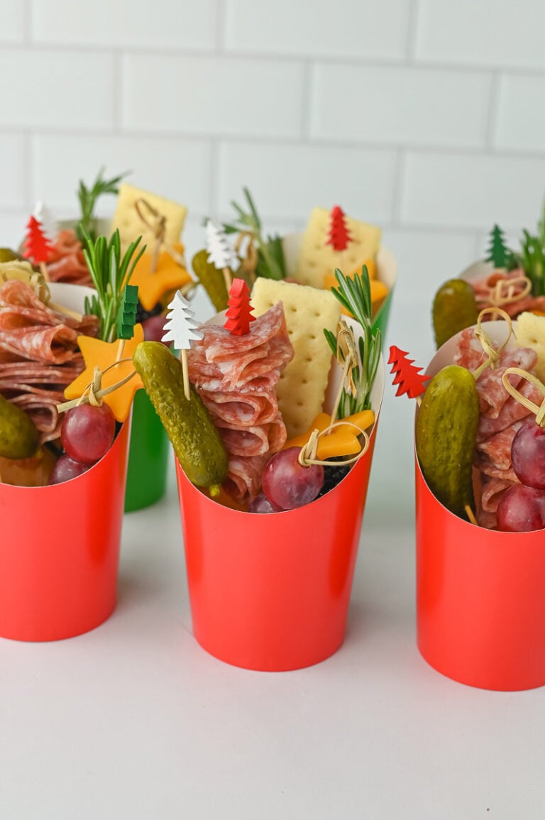 Christmas charcuterie cups on countertop.