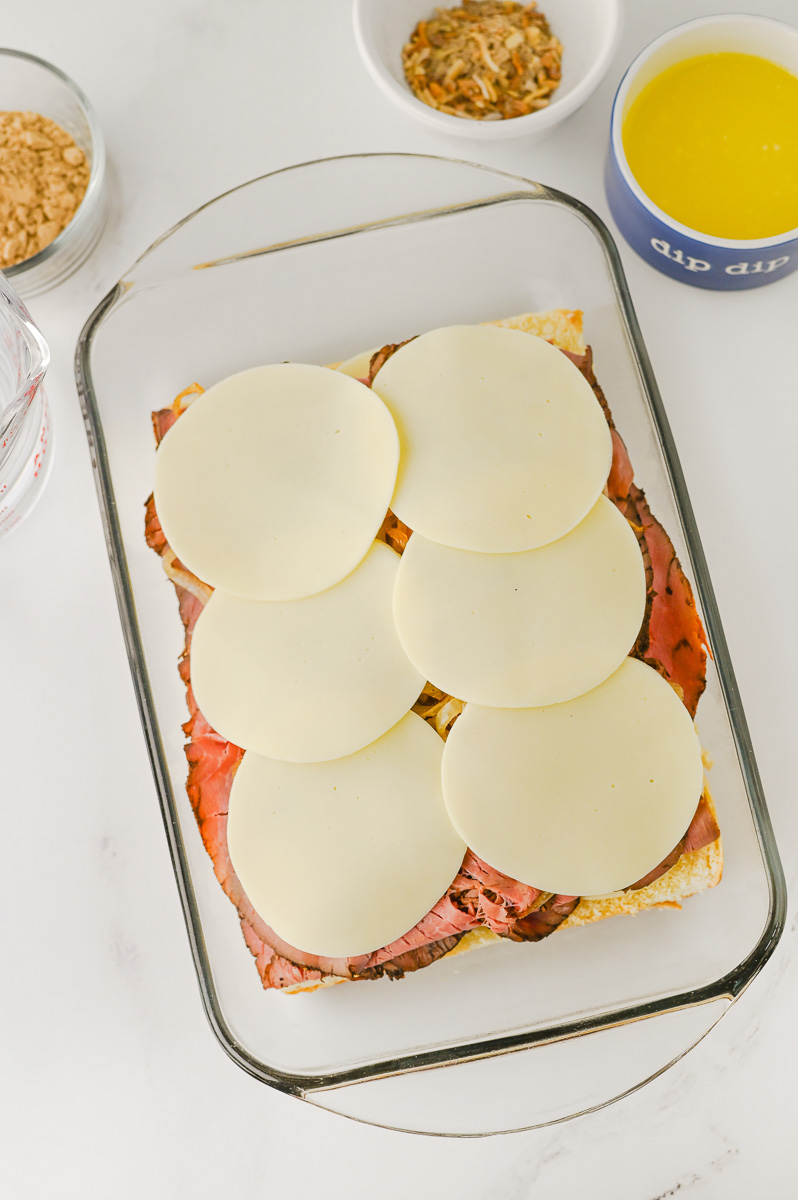 Provoline cheese is placed on top of the onion mixture (second layer).