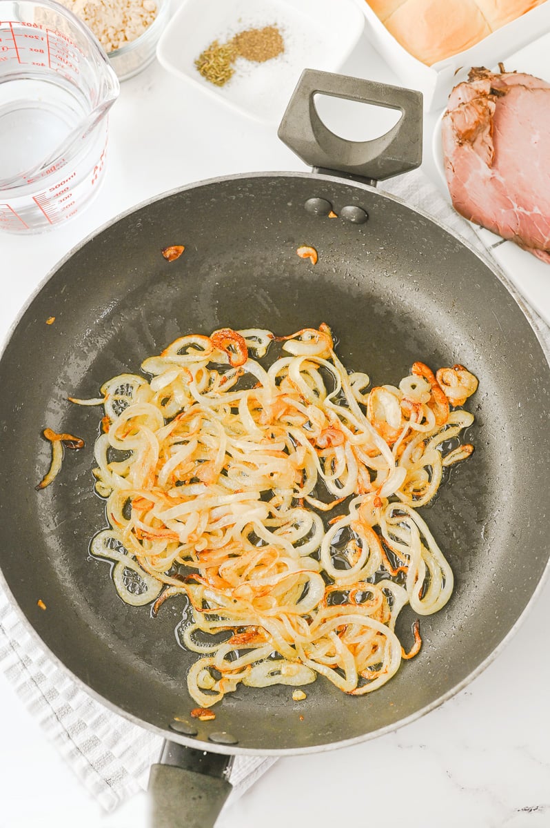 Butter and onions in skillet.