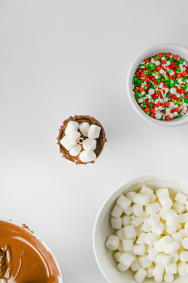 Mini marshmallows are adde to the top of the cups.