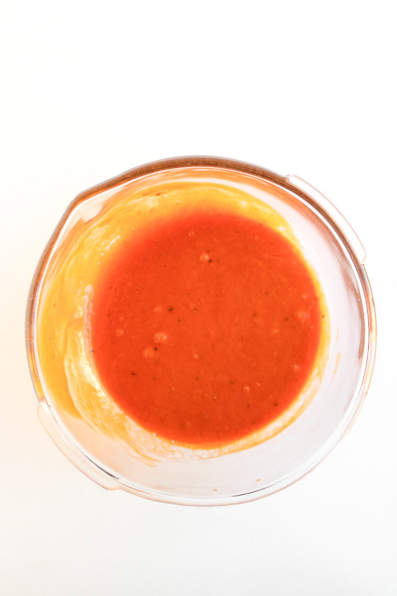 Sauce in mixing bowl on counter.