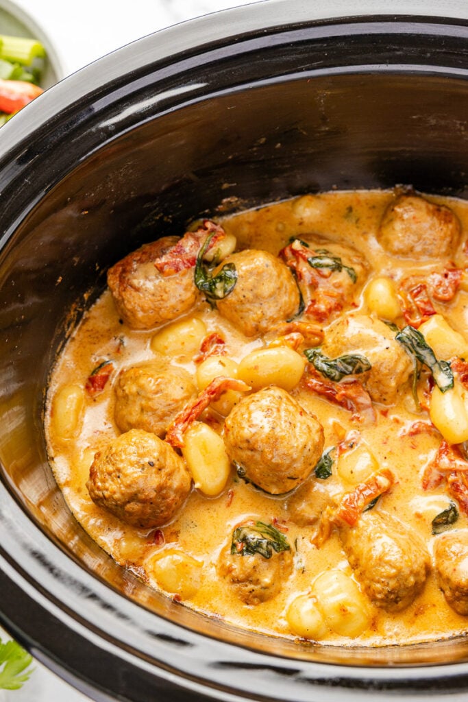 Crockpot tuscan chicken meatballs with gnocchi.