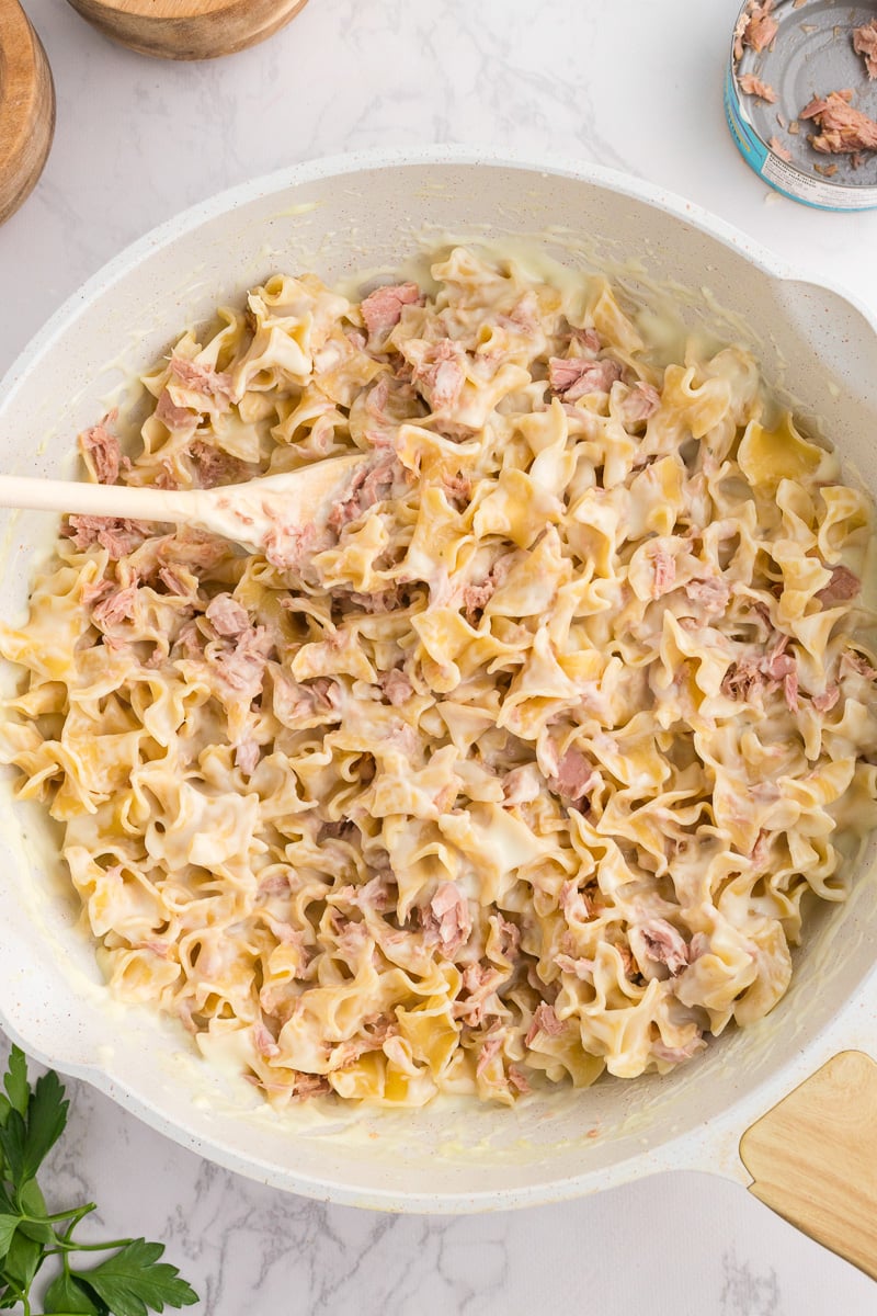 Tuna is stirred into the pasta and is ready to serve.