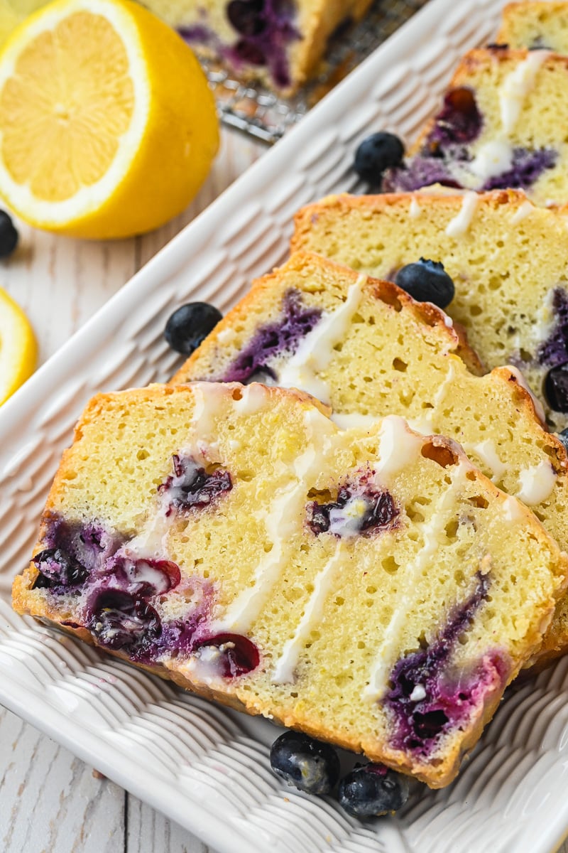 Loaf cake is drizzled with glaze.