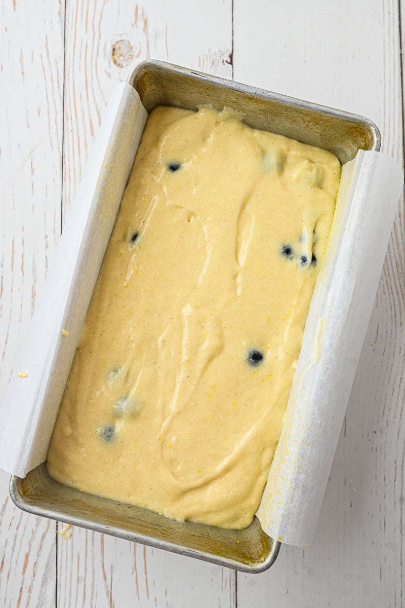 Batter is added to the prepared loaf pan.