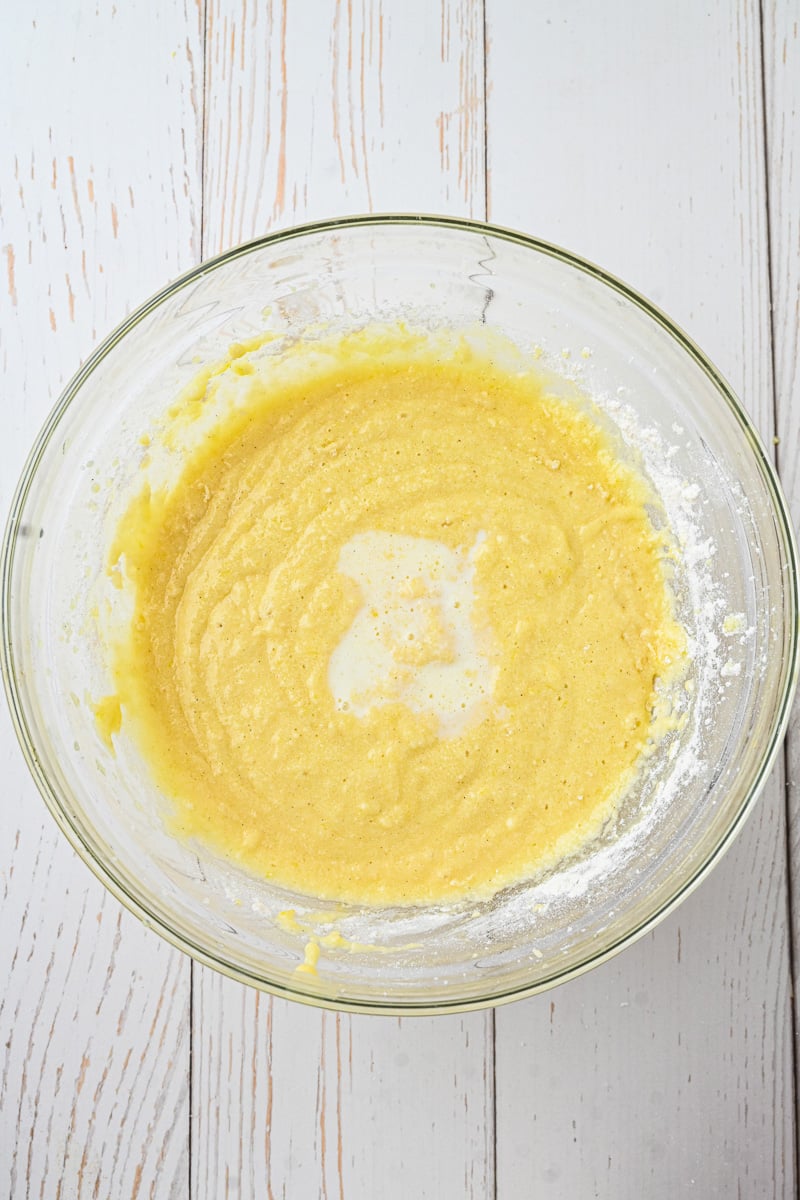 Eggs are mixed into butter and sugar.