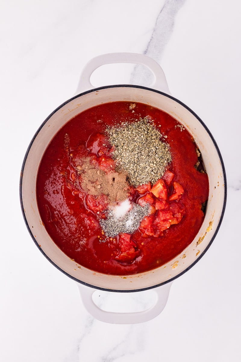 Tomato sauce is added to the meat mixture.