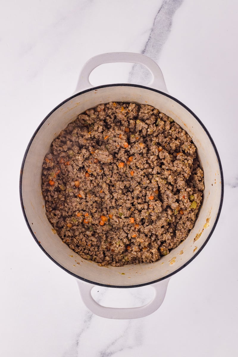 Ground beef and Italian sausage are aded to the vegetable mixture.