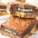 Oreo-stuffed brownies on a white plate.