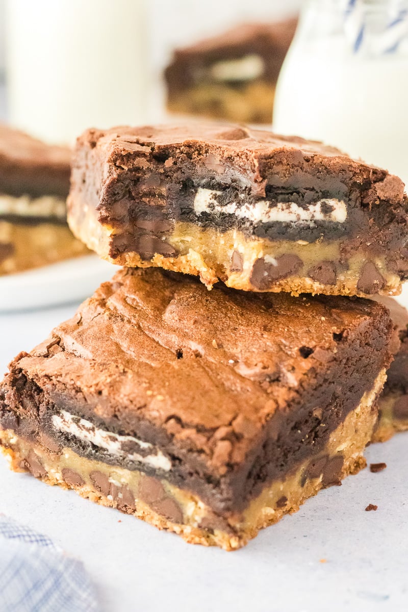 Oreo-stuffed brownies on a white plate.