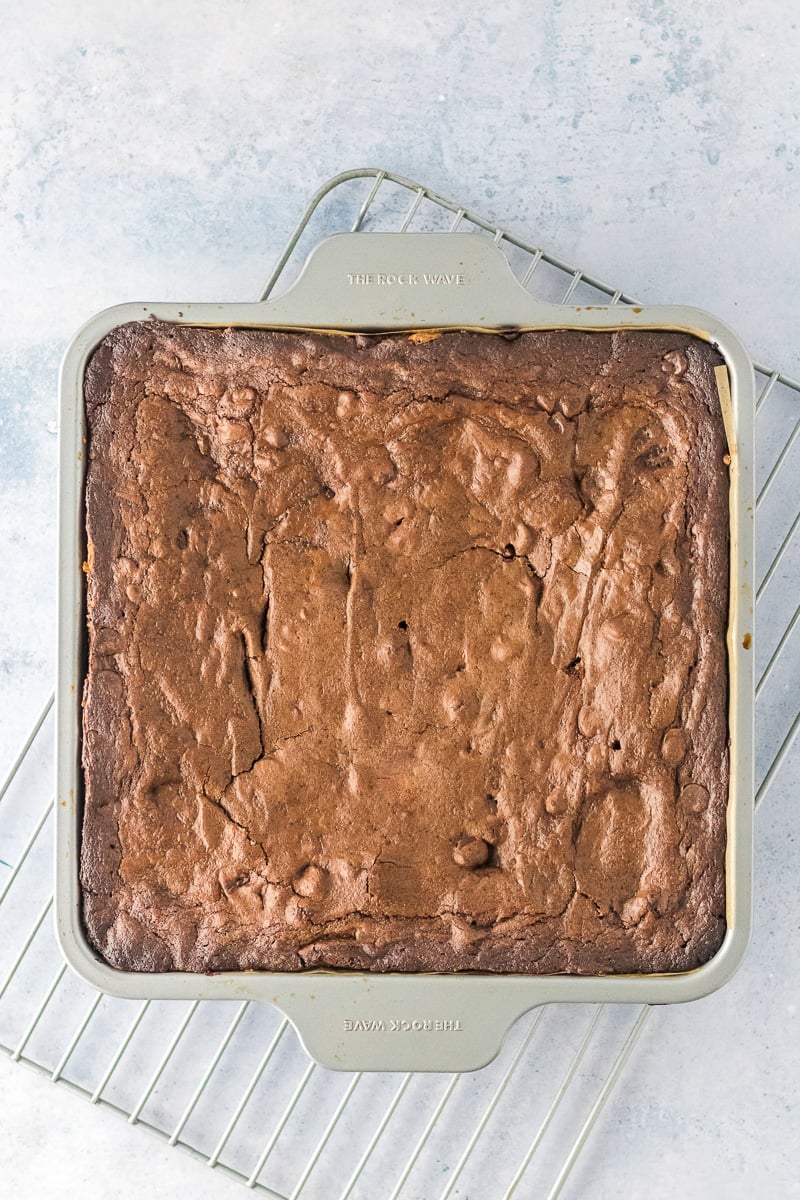Baked brownies on cooling rack.