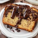 Serving of chocolate swirl banana bread on a plate.