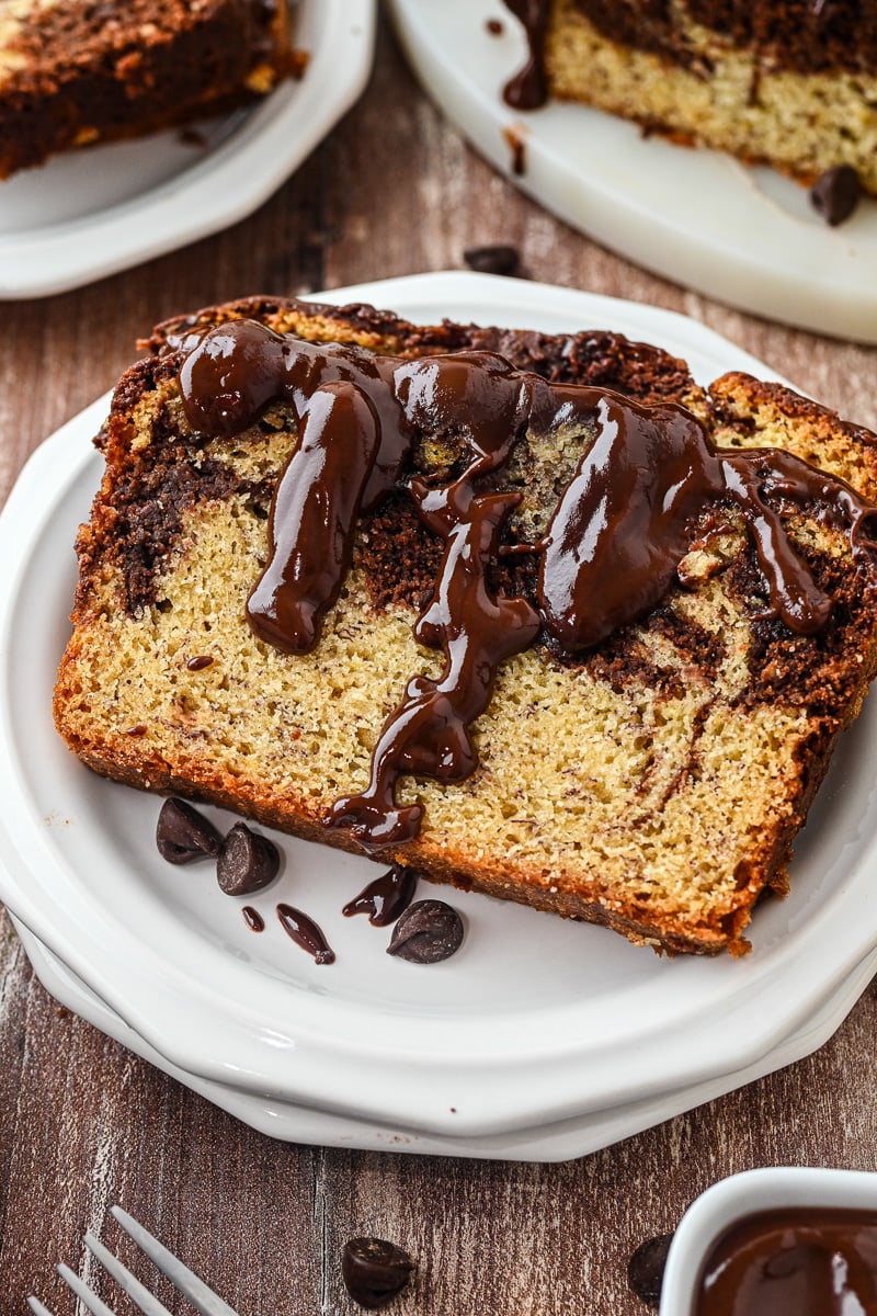 Serving of chocolate swirl banana bread on a plate.