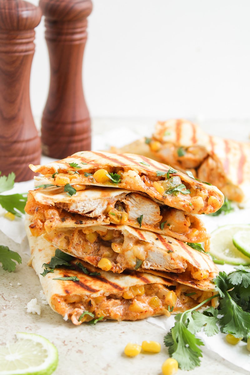 Mexican street corn chicken quesadillas stacked on a plate.