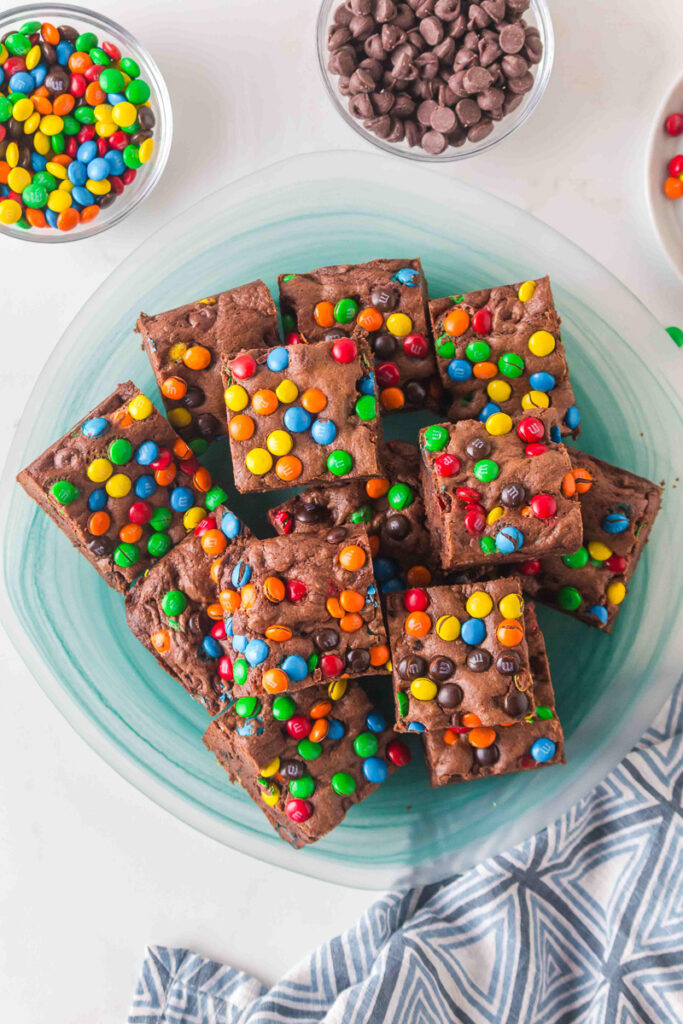 Overhead view of cake mix M&M brownies on a plate.