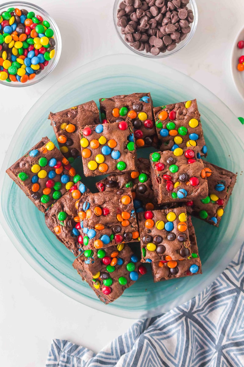 Overhead view of cake mix M&M brownies on a plate.