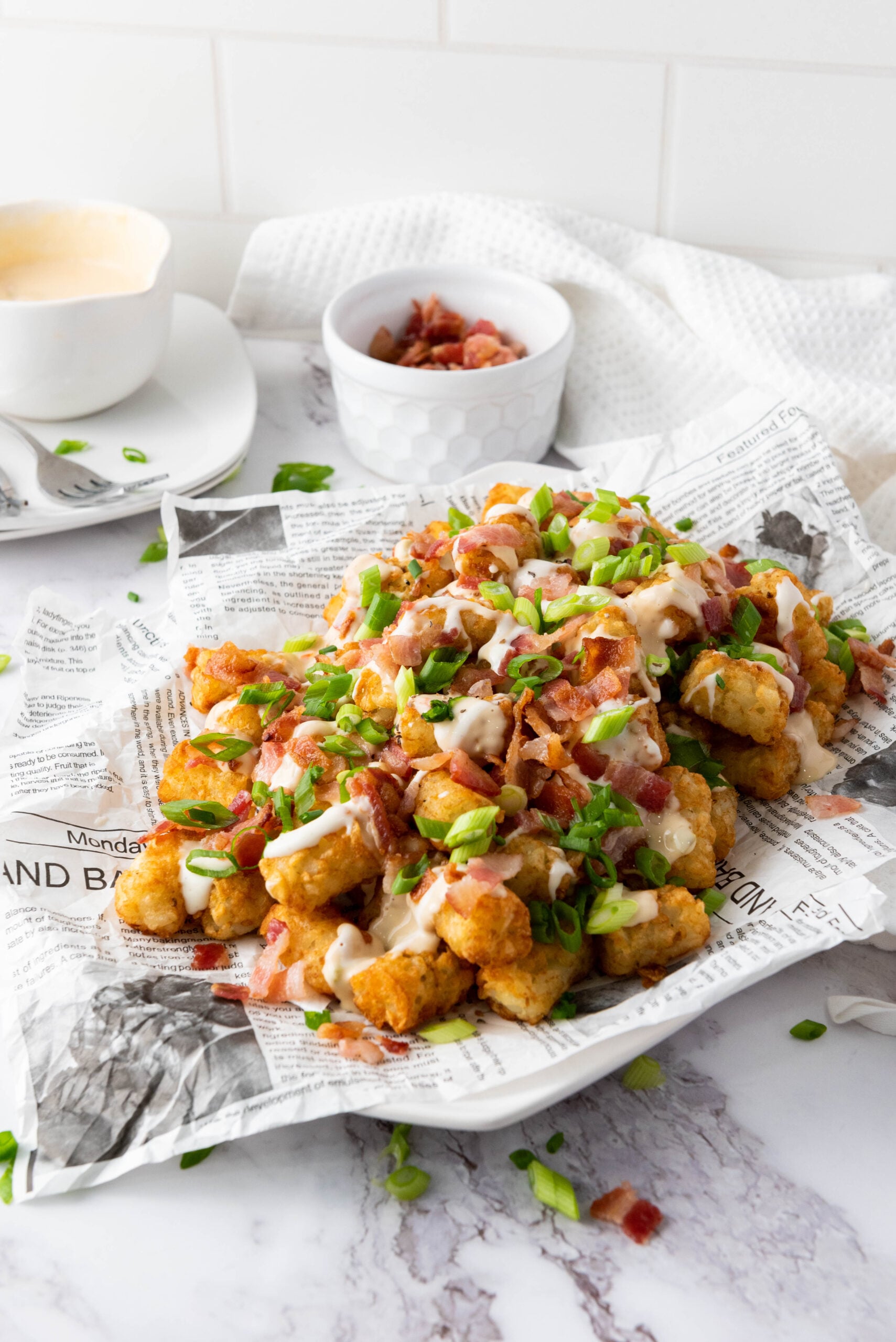 Side view of tater tots served on a plate for a party.