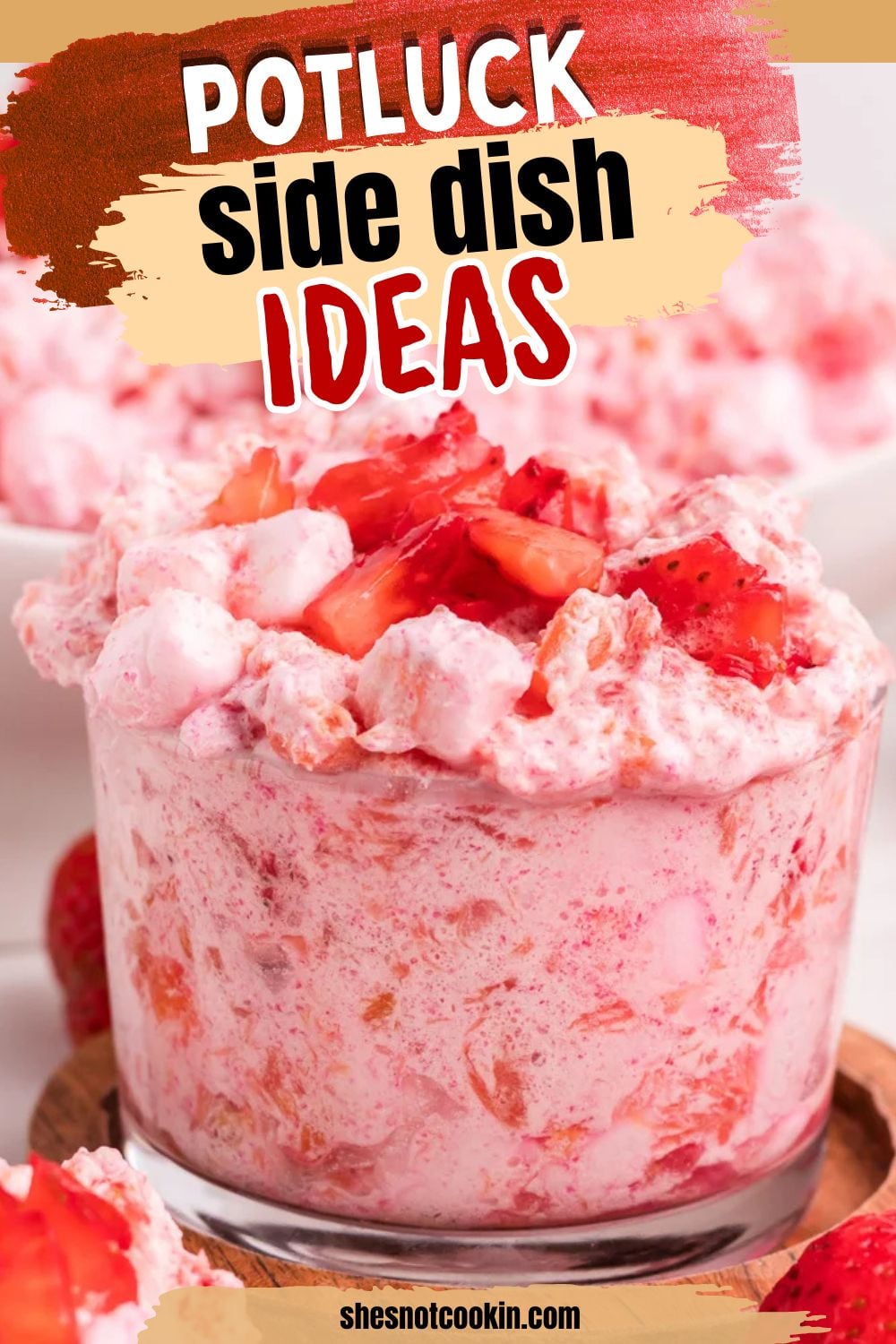 Strawberry fluff salad in a small glass bowl served for a backyard bbq.