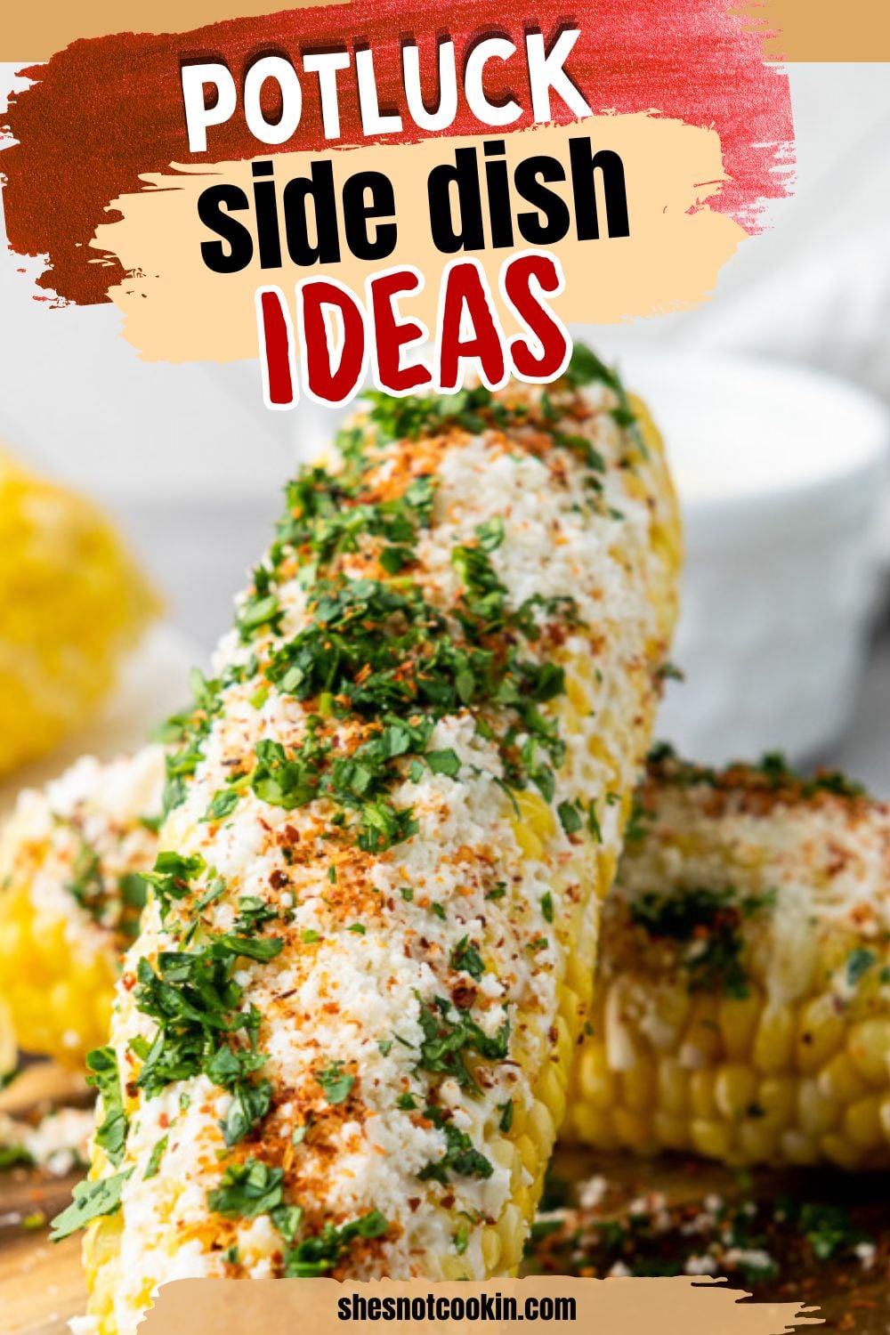 Mexican street corn served on wooden board for a backyard bbq party.