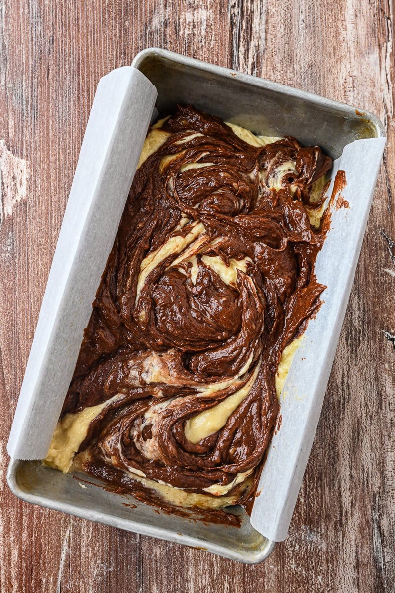 Remaining batter is aded to the top of the plain batter and sriled with a knife.