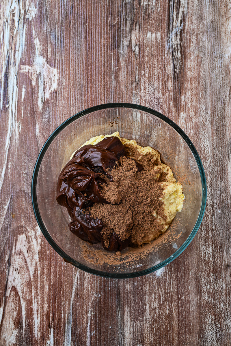 Some of the batter removed to a bowl and mixed in with cocoa powder and melted chocolate chips.