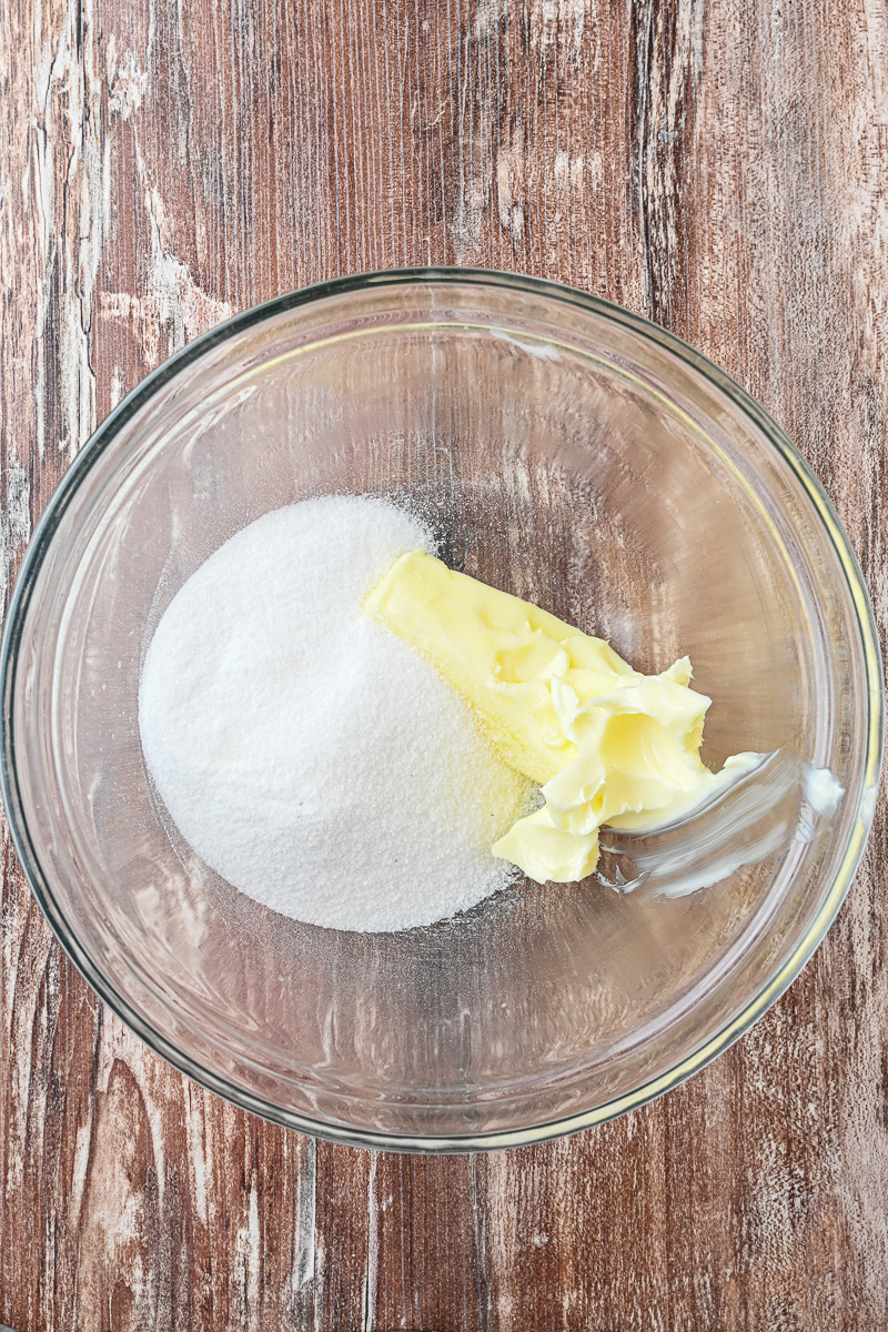 Butter and sugar in mixing bowl.
