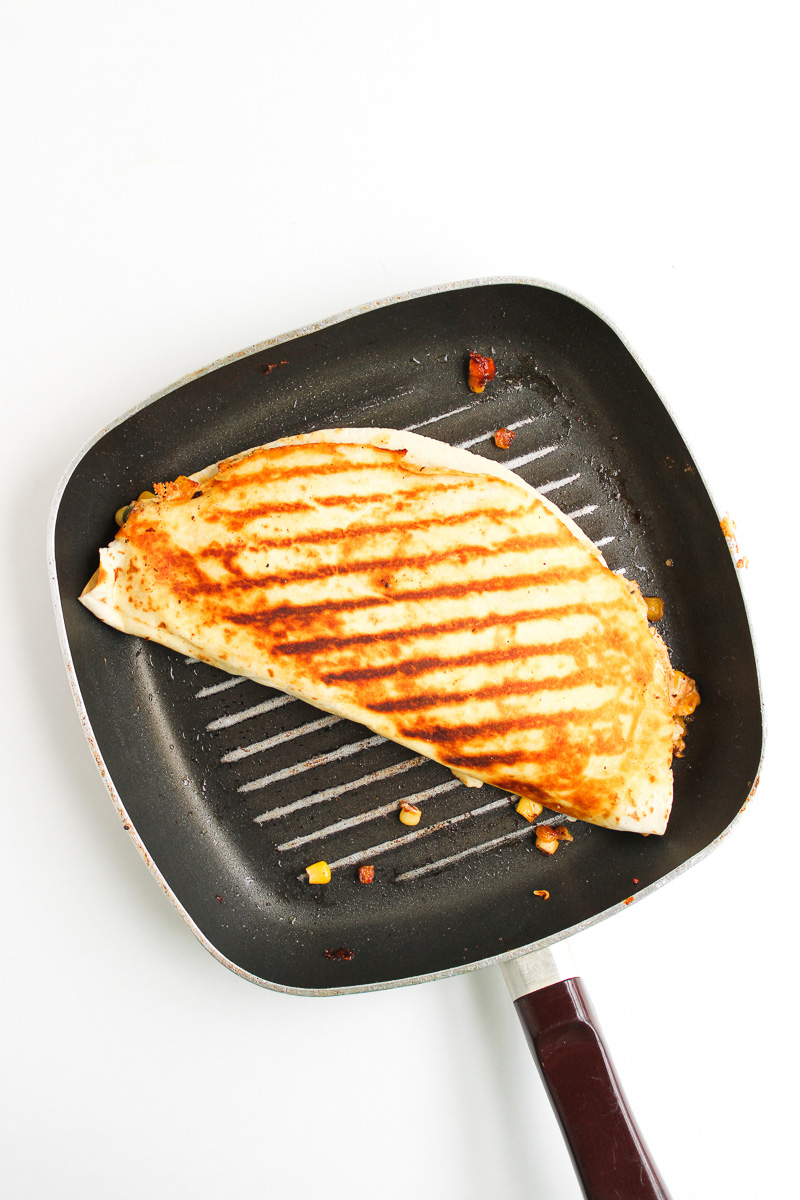 Grilled quesadill on cast iron grilling skillet.