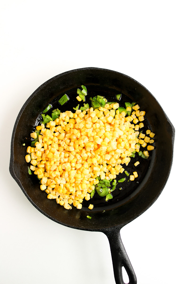 Jalapeno and corn in cast iron skillet.