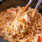 Crockpot chicken spaghetti in slow cooker ready to be served.